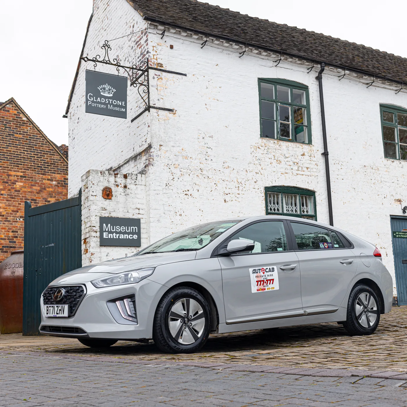 Autocab private hire car near a Stoke-on-Trent landmark