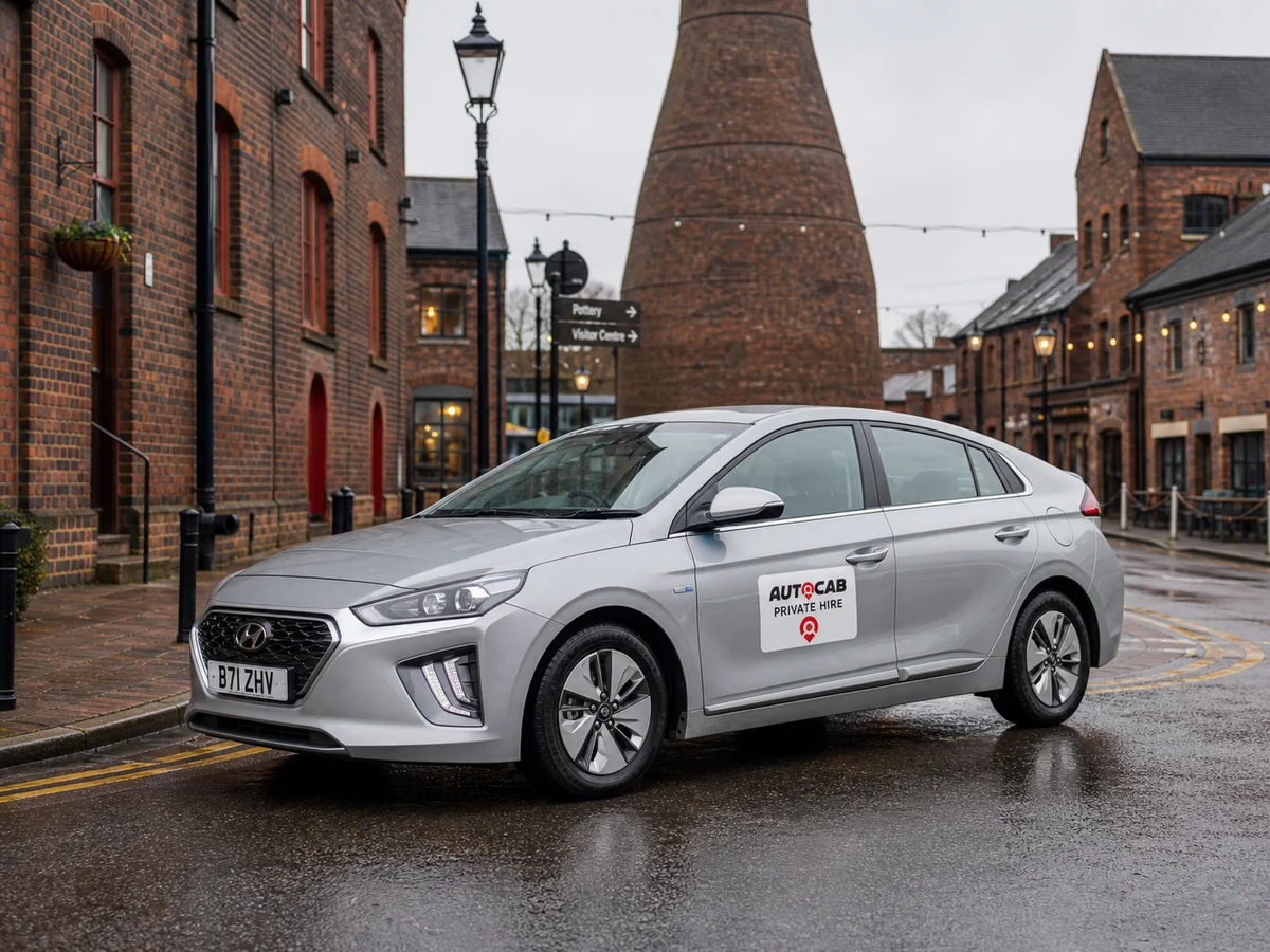 Autocab private hire car near Stoke-on-Trent pottery district buildings